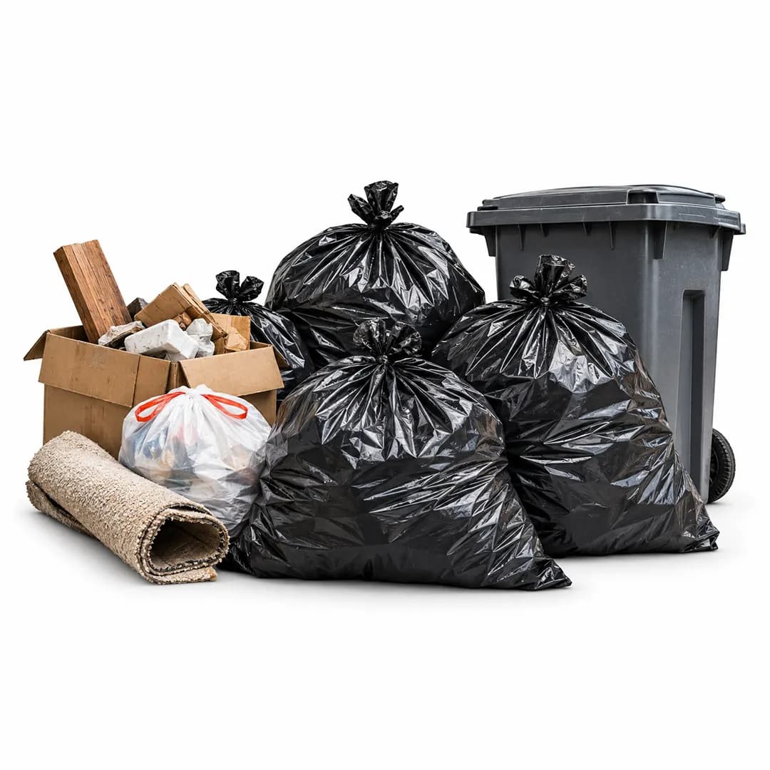 Tied trash bags, cardboard, a rolled rug and wheeled bin on a white background